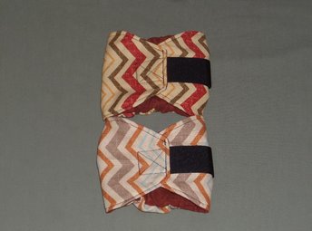 two rust chevron dog diapers